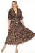 Woman wearing a leopard print pleated chiffon fit and flare dress