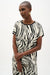 Woman wearing Joseph Ribkoff animal print silky knit back top for office outfit