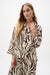 Woman wearing Joseph Ribkoff animal print A-line blouse for office workwear outfit