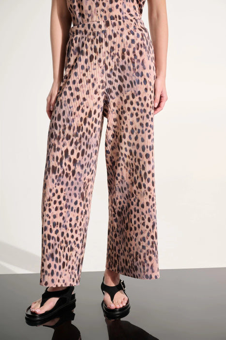 Woman wearing Joseph Ribkoff beige/multi animal print wide-leg pull-on pants styled for resort vacation, casual brunch, office chic, and evening dinner occasions.