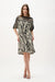 Woman wearing Joseph Ribkoff animal print straight dress featuring zebra-inspired black and beige pattern, knee-length cut, relaxed sleeves, and a modern flattering fit.