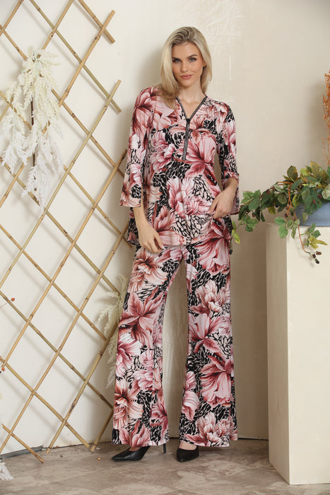 Woman wearing a floral printed wide leg pants with elastic waistband from Joseph Ribkoff