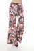 Woman wearing a floral printed wide leg pants with elastic waistband from Joseph Ribkoff
