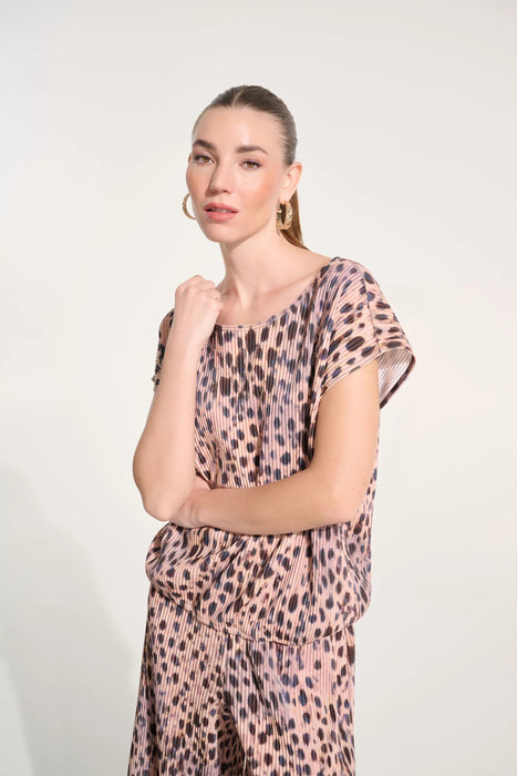 Woman wearing Joseph Ribkoff pleated animal print cocoon top styled for office chic, evening wear, and modern casual fashion outfits.