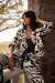 Woman wearing Joseph Ribkoff tropical print boxy blazer styled for resort wear, office chic, and modern summer evening outfits.
