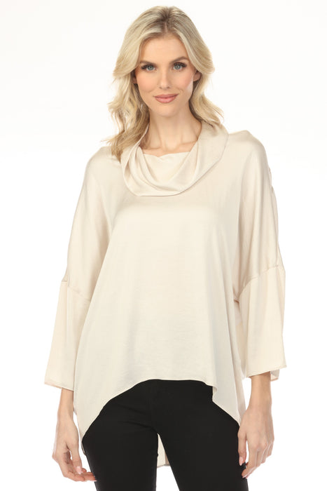 Woman wearing a cream-colored cowl-neck satin top with 3/4 sleeves from Joseph Ribkoff