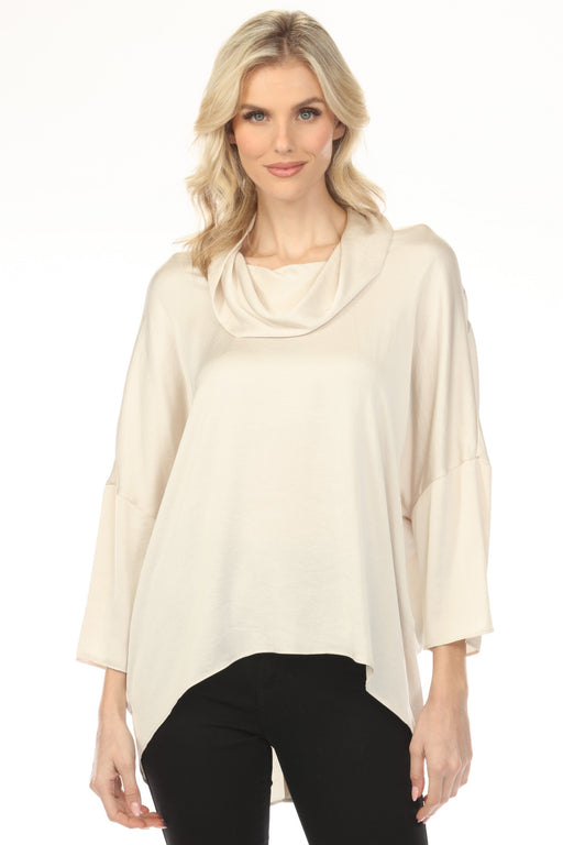 Woman wearing a cream-colored cowl-neck satin top with 3/4 sleeves from Joseph Ribkoff