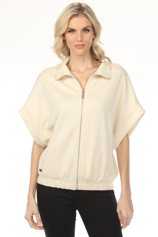 Woman wearing a cream-colored boxy zip front jacket with dolman sleeves from Joseph Ribkoff