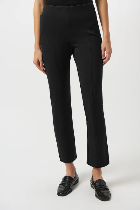 Woman wearing a black pull on slim ankle pant