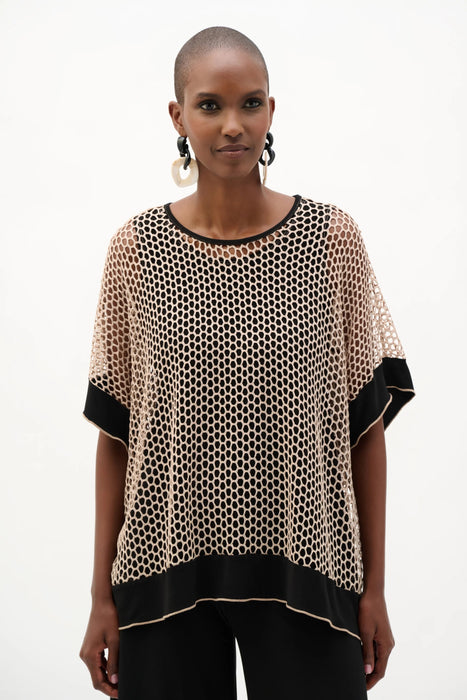 Woman wearing Joseph Ribkoff black and beige trapeze top with shimmer mesh styled for evening events, dinner outings, and elegant modern looks.