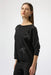 Woman wearing a black sweater top with iron-on bow embellishment and 3/4 sleeves from Joseph Ribkoff