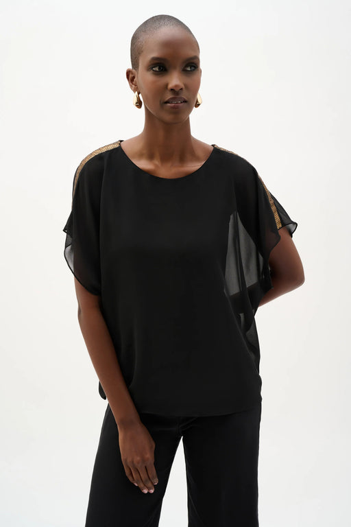 Woman wearing Joseph Ribkoff chiffon poncho top with sequined shoulder detail styled for evening wear, special occasions, and elegant casual outfits.