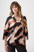 Woman wearing a black and brown abstract-patterned tunic top with cowl neck and 3/4 sleeves from Joseph Ribkoff