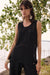 Woman wearing Joseph Ribkoff chevron stitch relaxed tunic top styled for layering, office casual looks, summer wear, and modern minimalist outfits.