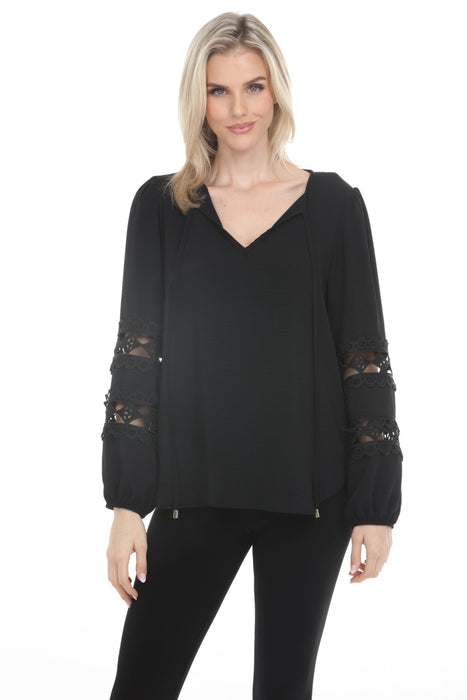 Woman wearing Joseph Ribkoff crochet sleeve tunic top for elegant office outfit