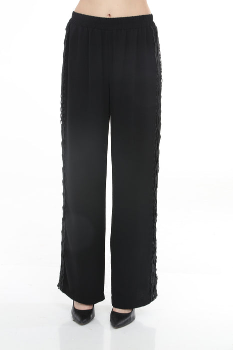 Woman wearing Joseph Ribkoff crochet trim wide-leg pants for elegant office outfit