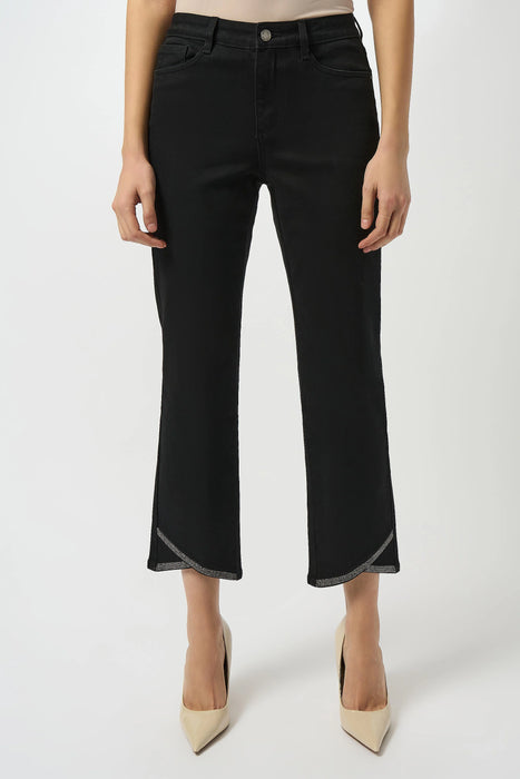 Woman wearing black cropped denim jean with rhinestone embellished tulip hem