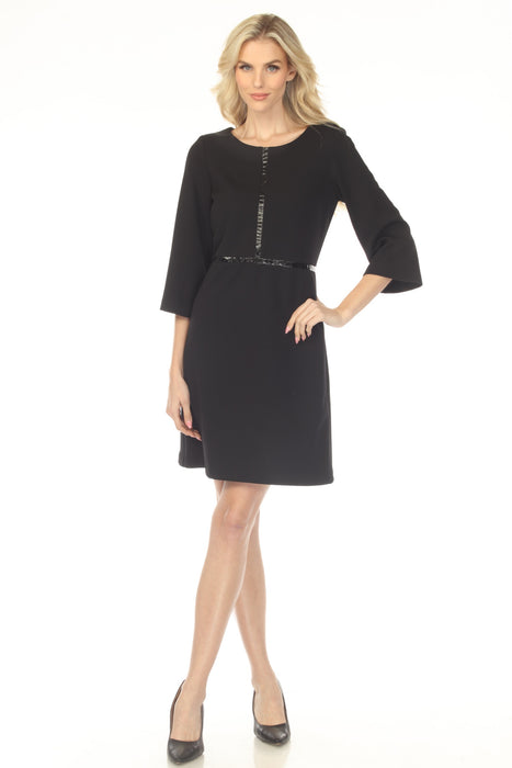 Woman wearing a black mini dress with faux leather trim and 3/4 sleeves from Joseph Ribkoff
