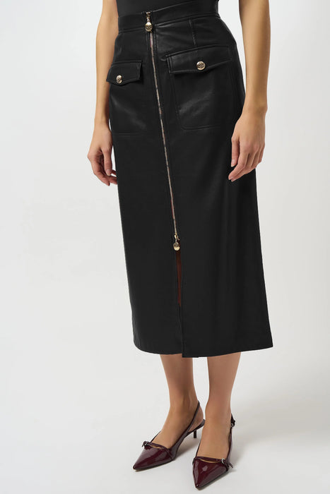 Woman wearing a black leatherette midi skirt with zip front closure and front slit
