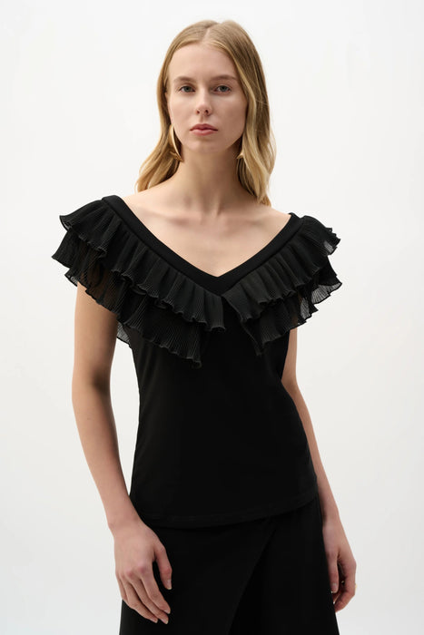 Woman wearing Joseph Ribkoff black fitted top with pleated ruffle neckline styled for evening wear, office outfits, and elegant occasions.