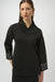 Woman wearing a black top with grommet detailed cuffs and wrap v-neck from Joseph Ribkoff