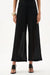 Woman wearing Joseph Ribkoff black knit chevron stitch culotte pants styled for office wear, evening outings, travel, and elevated casual occasions.