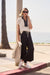 Woman wearing black wide leg pants with color block design from Joseph Ribkoff