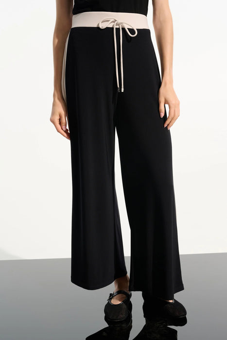 Woman wearing black wide leg pants with color block design from Joseph Ribkoff
