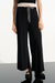 Woman wearing black wide leg pants with color block design from Joseph Ribkoff