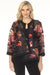 Woman wearing a floral patterned organza jacket with solid trim edges from Joseph Ribkoff