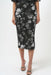 Woman wearing a black floral sequin patterned mesh midi pencil skirt