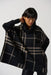 Joseph Ribkoff Style 233965 Black/Oatmeal Plaid Cowl Neck Knit Tunic Poncho Top