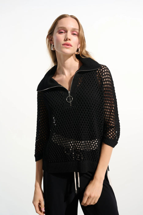 Woman wearing a black open knit sweater top with zip front and 3/4 sleeves from Joseph Ribkoff