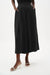 Woman wearing a black Joseph Ribkoff pull-on culotte pants with pleats, featuring flowy wide-leg silhouette, cropped length, and a flattering high-rise modern fit.