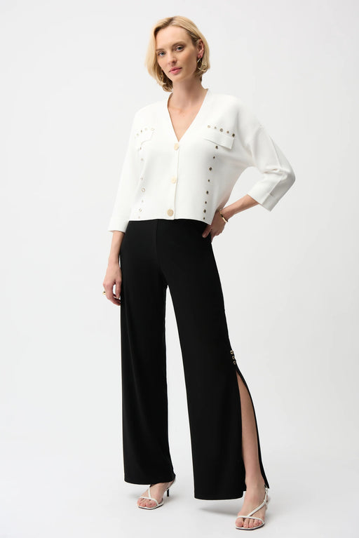 Woman wearing a black wide leg pull on pants with knee-length side slit from Joseph Ribkoff