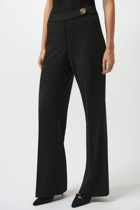 Woman wearing a solid color black wide leg trouser pant