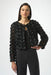 Woman wearing a black bolero jacket with rosette all over from Joseph Ribkoff