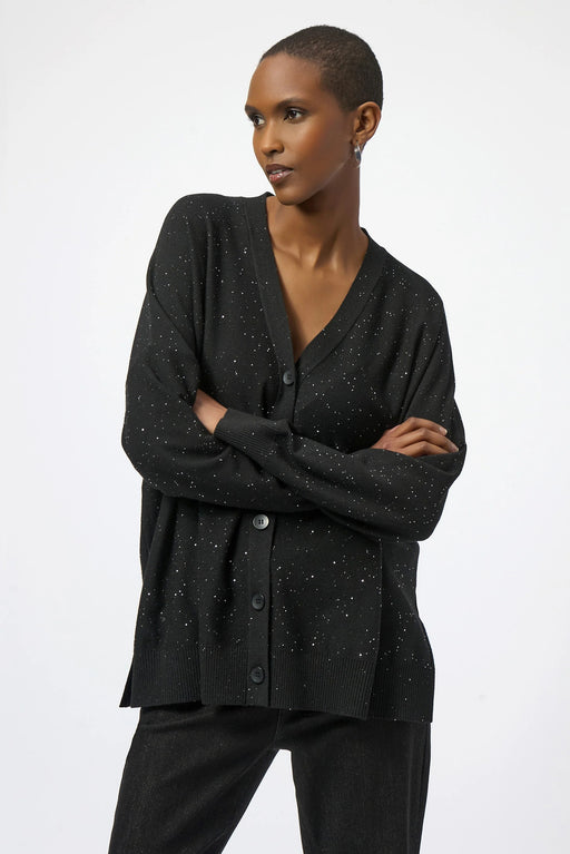 Woman wearing a black sequined cardigan with v-neck and button front from Joseph Ribkoff