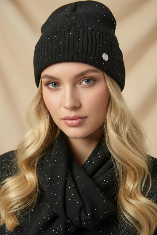 Woman wearing black sequined knitted beanie from Joseph Ribkoff