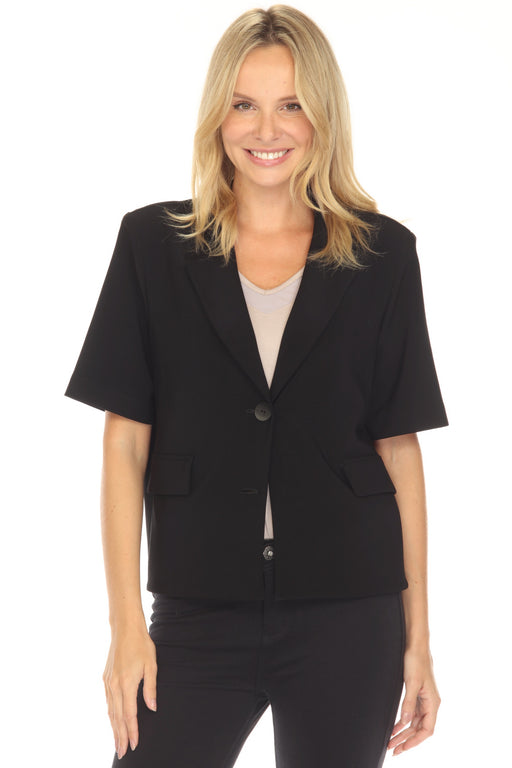 Woman wearing a black short-sleeve blazer from Joseph Ribkoff