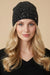 Woman wearing a black knitted beanie with silver sequins from Joseph Ribkoff