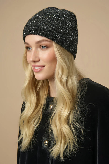 Woman wearing black knitted beanie with silver sequins from Joseph Ribkoff