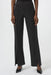 Woman wearing a black straight leg pant with split front hem