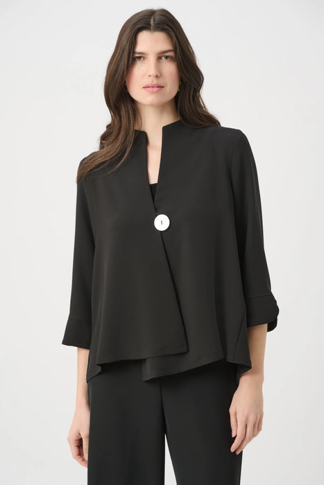 Woman wearing a solid black swing jacket with statement button and 3/4 sleeves from Joseph Ribkoff