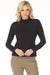 Woman wearing a black textured knit top with mock neckline and long sleeves from Joseph Ribkoff