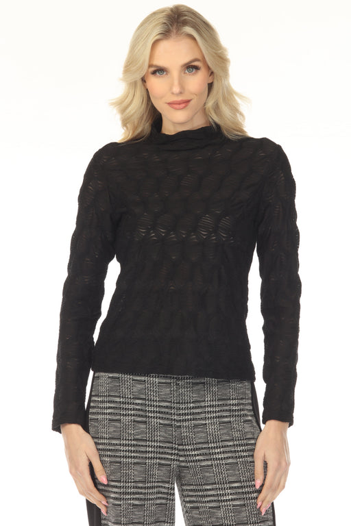 Woman wearing a black textured top with mock neck and long sleeves from Joseph Ribkoff