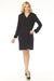 Woman wearing a black shirt dress with velvet collar and sleeve cuffs from Joseph Ribkoff