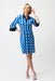 Woman wearing Joseph Ribkoff dot print shirt dress for chic office outfit