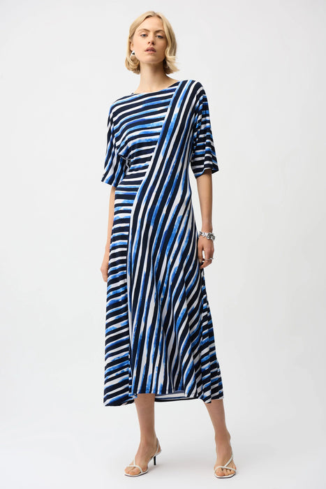 Woman wearing Joseph Ribkoff stripe print fit and flare dress for office outfit
