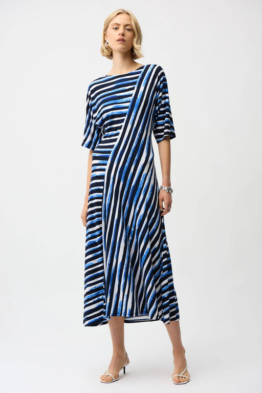Woman wearing Joseph Ribkoff stripe print fit and flare dress for office outfit